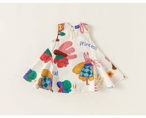 Detail of baby girl sleeveless dress showing cartoon rabbit and strawberry prints