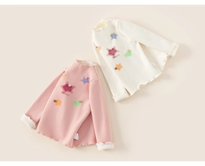 Detail of toddler long sleeve cotton shirts with ruffles and star heart patches