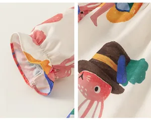 Detail of elastic cuffs and colorful cartoon print on soft cotton children dress
