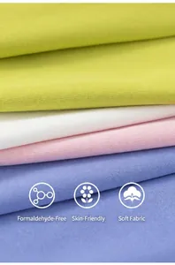 Close-up of soft cotton knit fabric layers in green, white, pink and blue colors