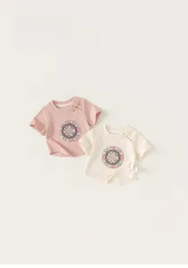 Detail of traditional Chinese frog button and floral embroidery on kids cotton t-shirts