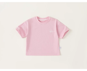 Detailed view of pink kids' cotton T-shirt featuring 'Beauty is an attitude' graphic print
