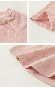 Detail of traditional Chinese frog fastener on pink ribbed fabric with fine stitching