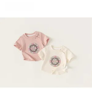 Detail of traditional Chinese knot buttons and flower embroidery on kids cotton t-shirts
