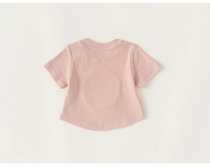 Detail of pink cotton baby t-shirt featuring ribbed fabric and traditional round collar