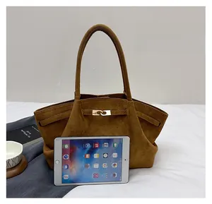 Detailed comparison of brown faux suede tote bag size shown next to an iPad device