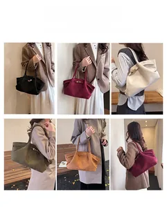 Detail showcasing the collection of large suede tote bags in various stylish colors