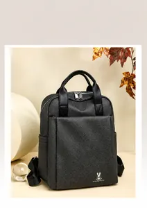 Detailed view of dark grey business backpack with fine canvas texture and bunny logo accent