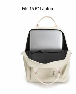 Detail view of beige laptop backpack interior holding a 15.6 inch silver notebook