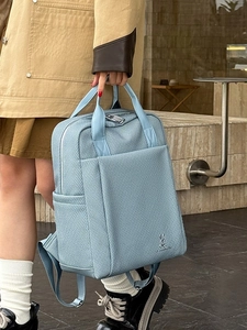 Light blue business leisure backpack with dual top handles and durable canvas texture