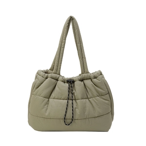 Quilted puffer tote bag in olive green with spacious interior and drawstring closure