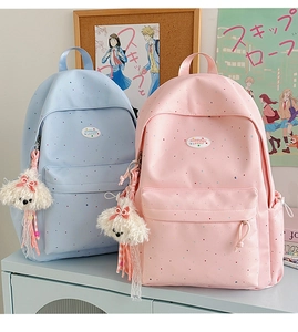 Gepunktete Rucksäcke in Pink und Blau mit niedlichen Plüschwelpen für Schüler