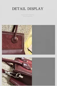 Detail of burgundy leather and suede stitching with silver metal hook hardware