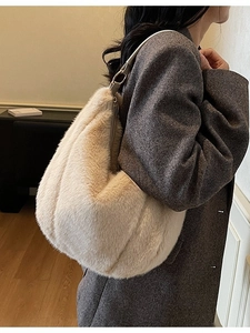 Chic cream faux fur underarm bag for women worn with a coat in a modern setting