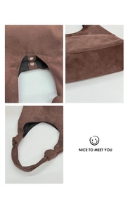 Detail of coffee brown faux suede tote showing magnetic closure and knotted strap
