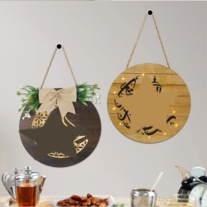Detail of wooden moon festival door signs with linen bows and artificial greenery decor