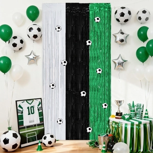 Soccer theme party set with white black green fringe curtains and football balloons
