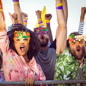 Cinco de Mayo party glasses with cactus and guitar motifs worn by a festive crowd