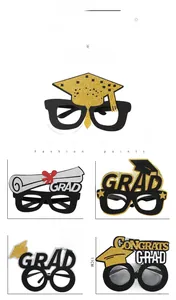 Detailed view showing five styles of graduation photo props with gold glitter GRAD letters