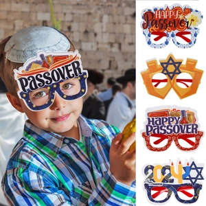 Detailed view of four colorful Passover paper glasses for holiday party decorations