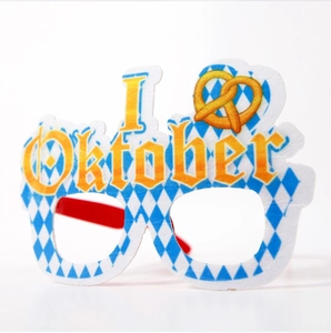 Close-up of Oktoberfest party glasses with blue white checkered pattern and pretzel detail