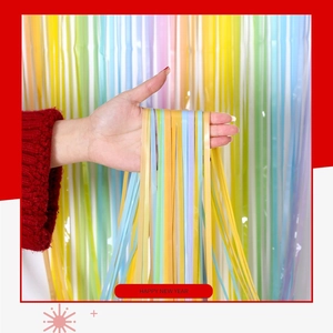Close-up of macaron laser fringe curtain with shimmering colorful rainbow party streamer