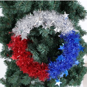 Independence Day wreath with red silver blue tinsel and stars on Christmas tree