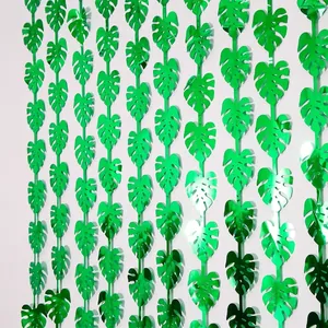 Green metallic monstera leaf fringe curtain for tropical Hawaiian party wall decoration