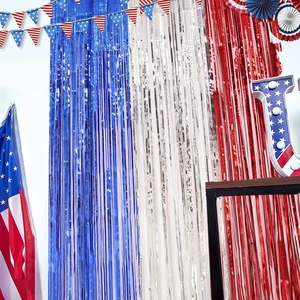 Close-up of metallic red, white and blue foil fringe curtains for July 4th party decor