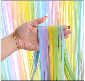 Detail of macaron gradient fringe curtain backdrop for birthday party scene decoration