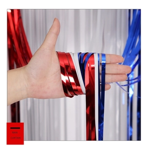 Detail of shiny red white and blue metallic foil fringe curtains for party decor