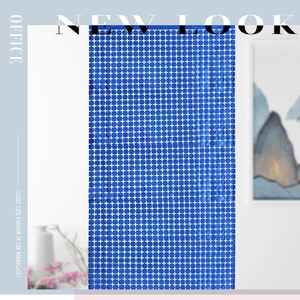 Detail view of blue square laser foil fringe curtain with white cross star pattern decor