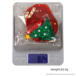 Detailed view of Christmas tiered tray wooden decor set being weighed at 82.4g on a scale