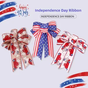 Detailed view of three Independence Day decorative bows with stars, stripes, and truck patterns