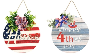 Close-up of wooden Independence Day door signs with Home Sweet Home and Happy 4th July text