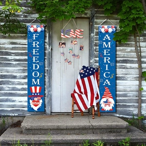 Outdoor porch display of July 4th patriotic banners featuring Freedom and America text