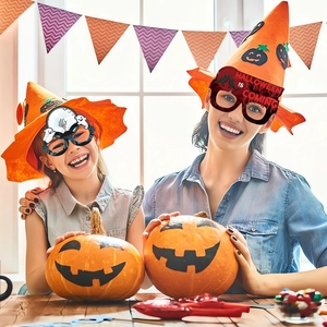 Family wearing Halloween paper pumpkin glasses and wizard hats in a festive home setting