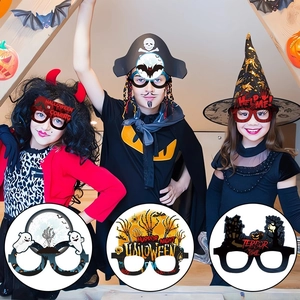Detail view of paper Halloween glasses with spooky pumpkin and ghost party props