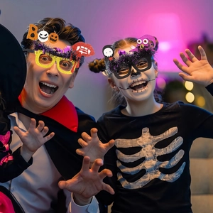 Halloween party glasses with glitter pumpkin and wizard hat decorations for festive costumes