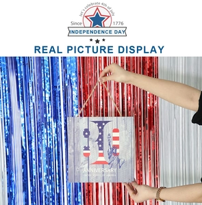 Detail of wooden Fourth of July sign with anniversary print and twine rope hanging