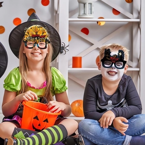 Detail of paper Halloween glasses with horror night and terror time theme designs