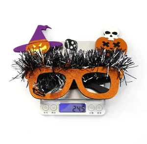 Halloween party glasses with pumpkin hat and skull weighing 24.5g on a scale
