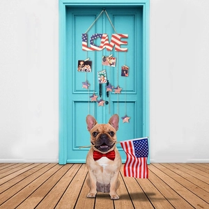 Detail of wooden LOVE sign with American flag pattern and hanging clips for photos