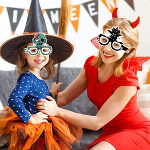 Adult and child models wearing Halloween zombie and bat paper eyewear for party costume fun