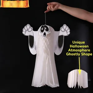 Hanging 3D white honeycomb ghost decorations with spooky expressions for Halloween parties