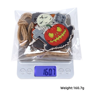 Detailed weight measurement of Halloween wooden ornaments in a transparent PE bag