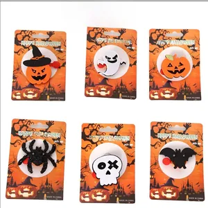Macro view of Halloween LED rings set featuring felt pumpkins, ghosts, and spiders