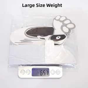 Weight measurement of a large Halloween prop showing 65.7g on an electronic scale