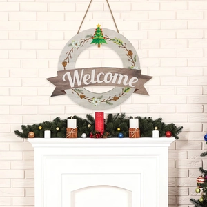 Welcome wooden door sign with Christmas pine cones and tree decor on white brick wall
