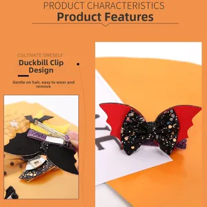 Close-up of red bat wings and black sequin bow hair clip for Halloween parties